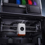 Close-up of the Apex Pro Color print head, rails and touchscreen inside the enclosure