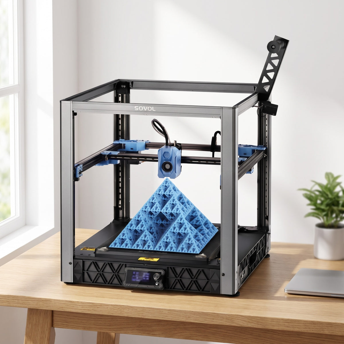 Atlas XL 3D printer on a wooden desk in a bright home office