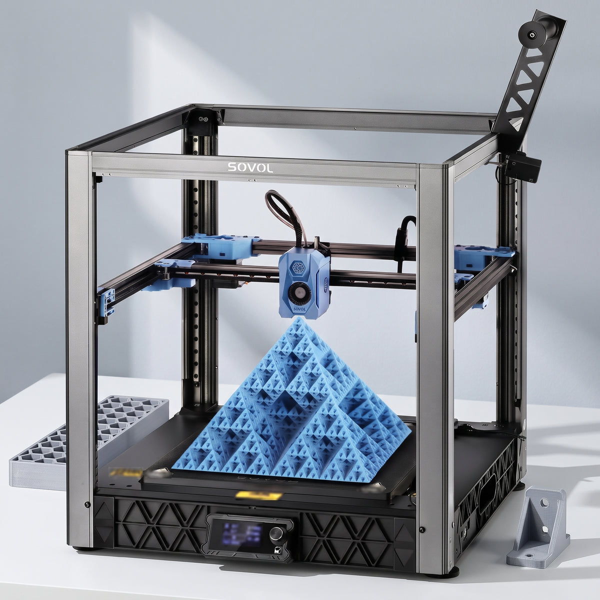 Atlas XL 3D printer with a large single-color honeycomb tray and a printed bracket