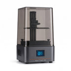 Aura One 7-inch 10K resin 3D printer with smoky gray cover and front touchscreen, on a white background