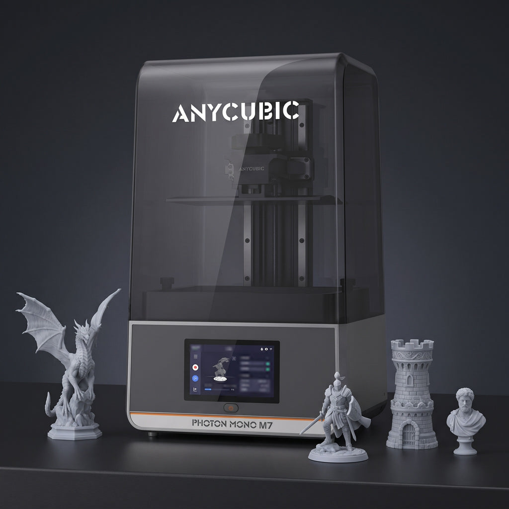Aura Max resin 3D printer with detailed gray resin prints: a dragon, a knight, a castle tower and a bust