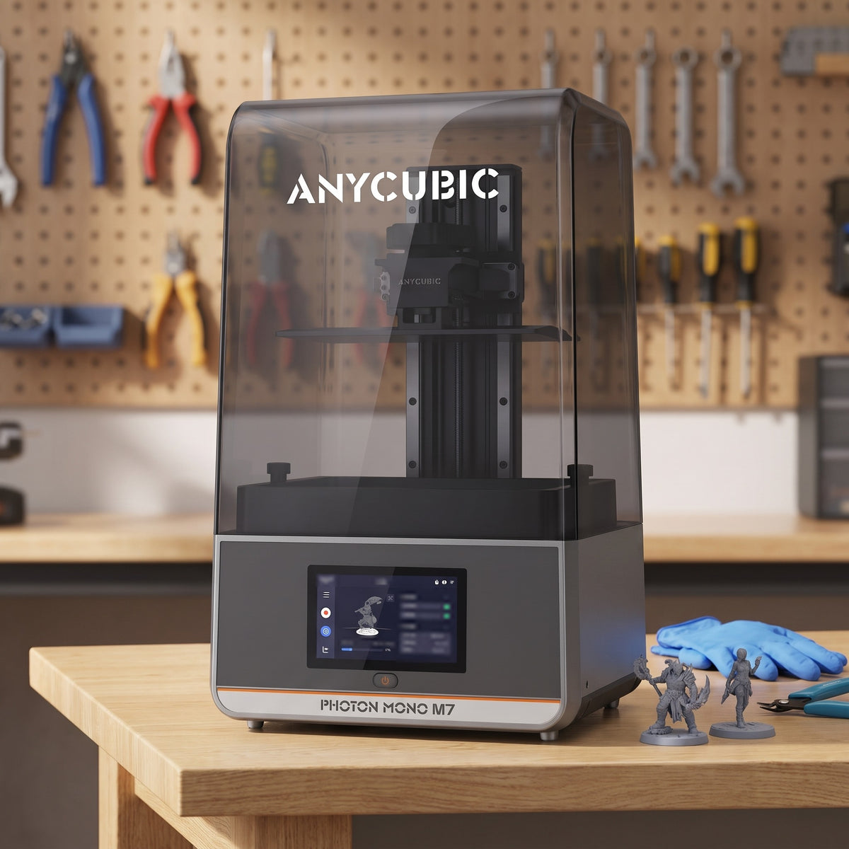 Aura Max resin 3D printer on a workshop bench with nitrile gloves, flush cutters and resin miniatures