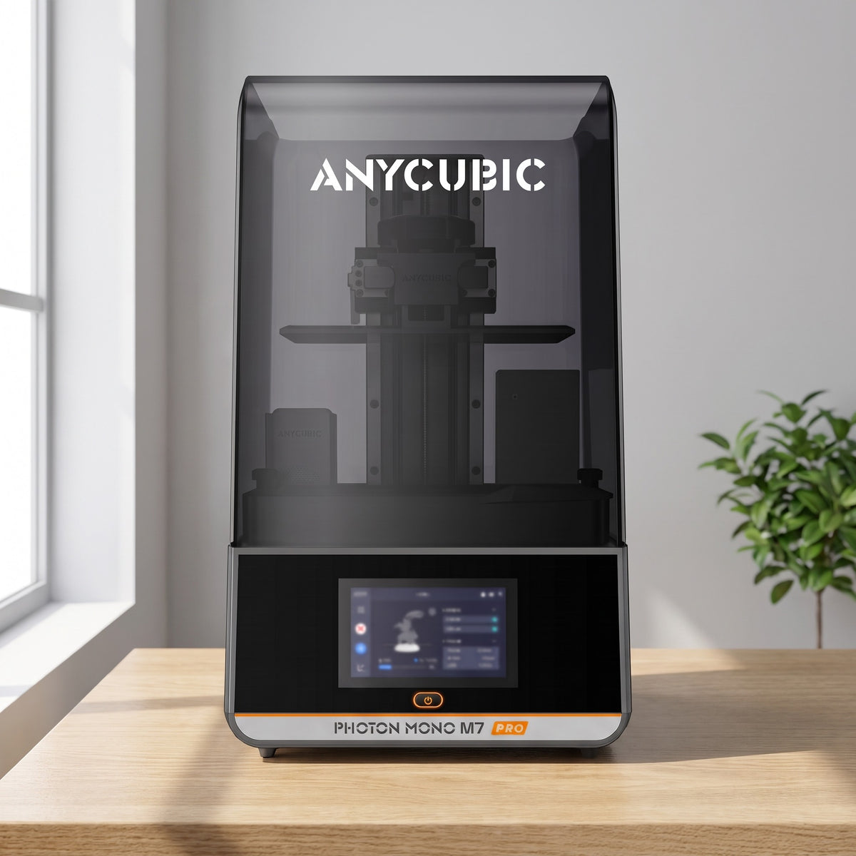 Aura Max Pro resin 3D printer on a light oak desk in a bright room