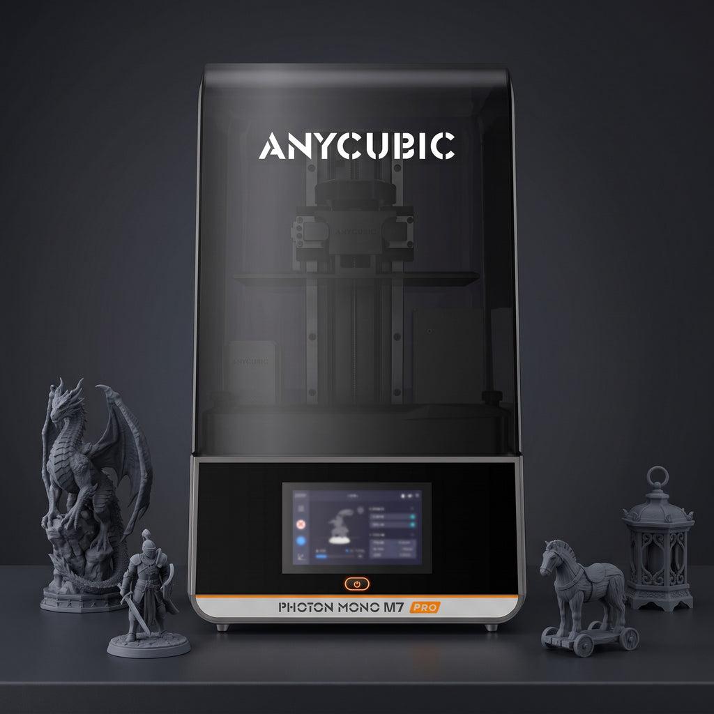 Aura Max Pro resin 3D printer with detailed gray resin prints: a dragon, a knight, a horse on wheels and a lantern