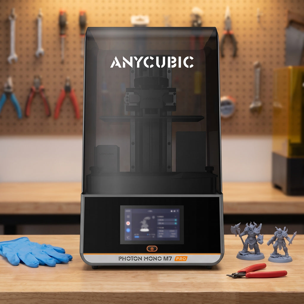 Aura Max Pro resin 3D printer on a workshop bench with nitrile gloves, flush cutters and resin miniatures