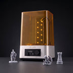 Finish Pro+ wash and cure station with cured gray resin miniatures: a knight, a dragon and a chess rook