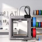 Fusion Multi 3D printer on a white workbench in a product-design studio with calipers and a printed bracket