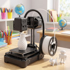 NeoCraft+ mini 3D printer on a classroom table with colored pencils, notebooks and two small printed figures
