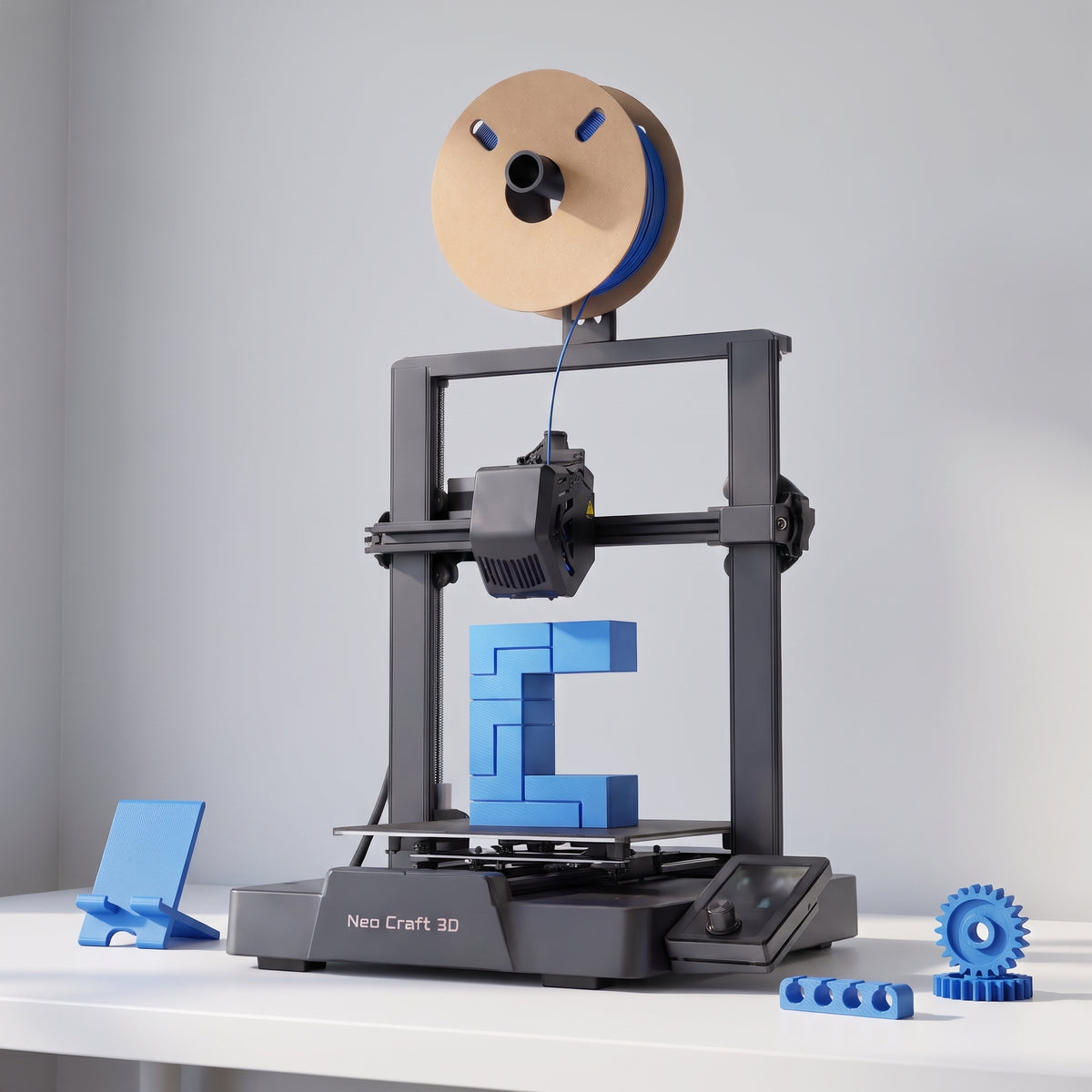 Nova X3 3D printer with blue printed functional parts: a phone stand, a cable clip and gears