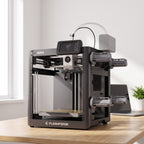 Spectra Color 3D printer on a light oak desk in a bright home office