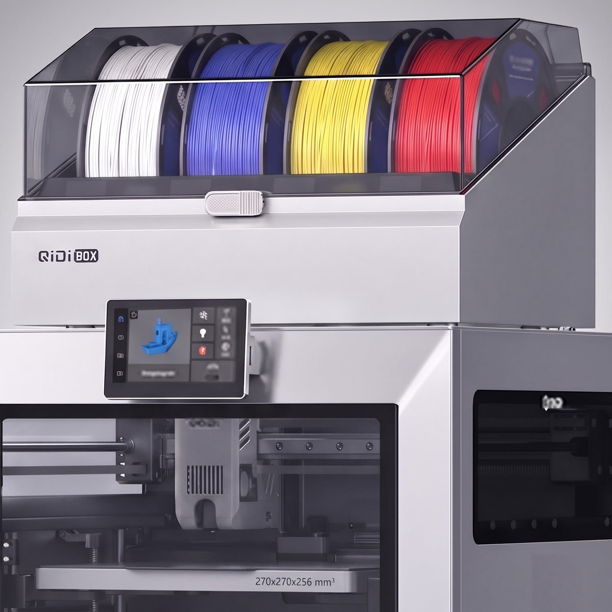 Close-up of the Titan Color filament box with four spools, touchscreen and print head
