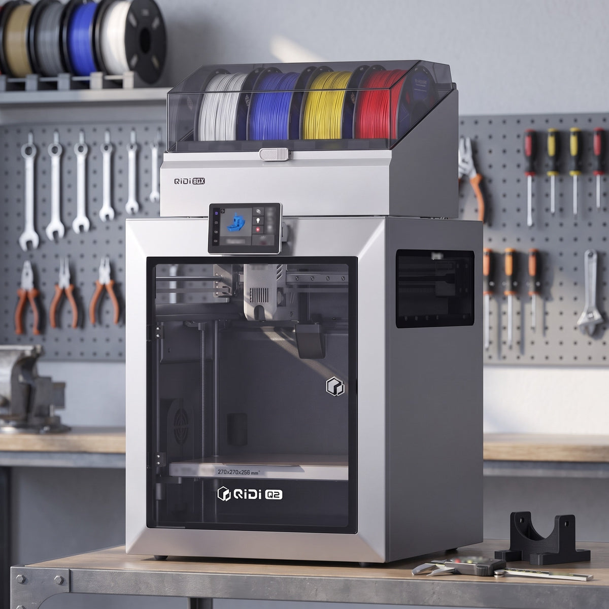 Titan Color 3D printer on a steel-and-wood workbench in an engineering workshop with calipers and a printed bracket