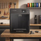 Vault Pro enclosed 3D printer on a wooden workbench in a maker workshop with calipers and a printed part